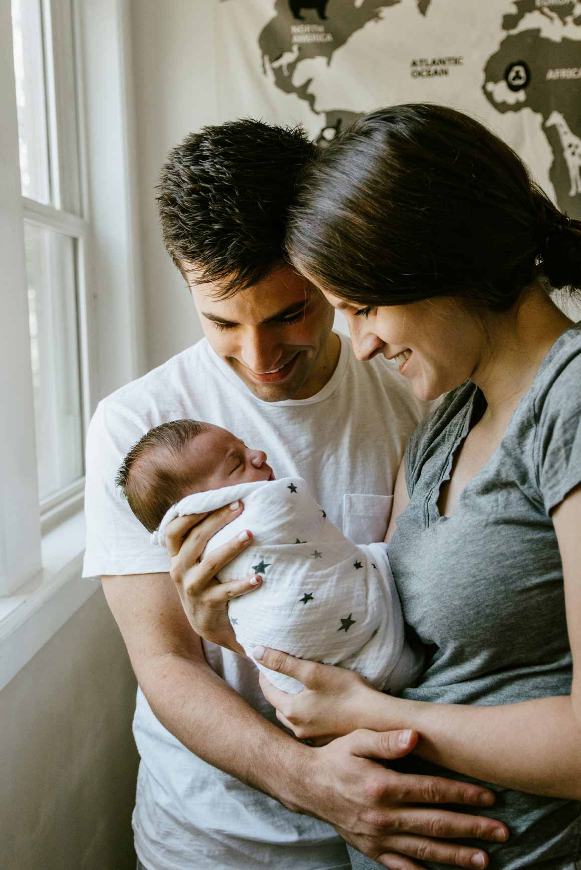 Father and Mother Holding Infant